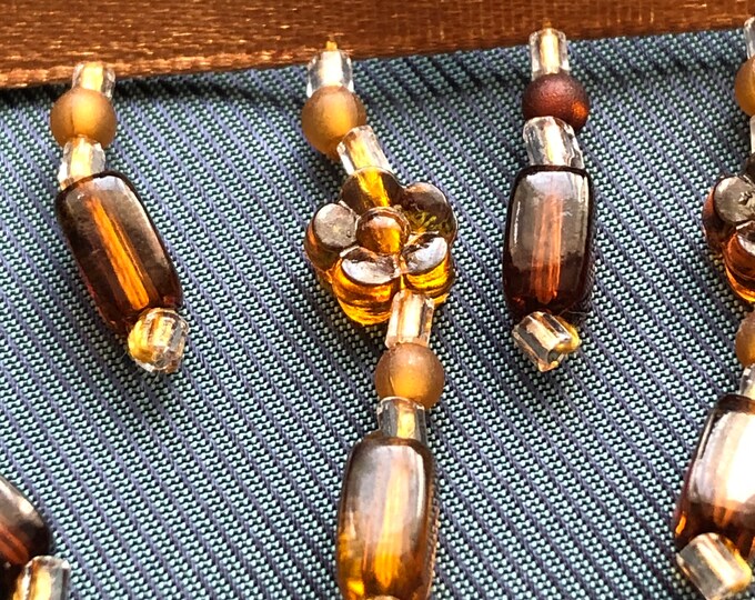 Golden brown ribbon with beading, embellishment, notions