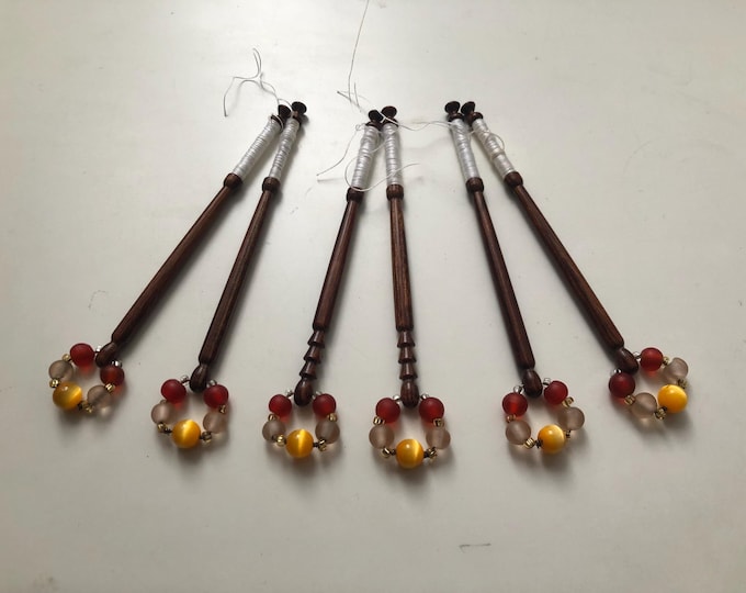 6 wooden lace bobbins with spangles
