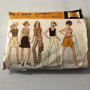 May include: Vintage McCall's sewing pattern number 5346 for a skirt and blouse. The pattern shows five women wearing different versions of the outfit. The pattern is printed on a white background with brown text and illustrations.