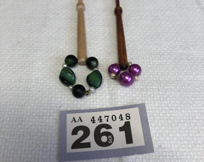Pair of small vintage wooden lacemaking bobbins, with spangles