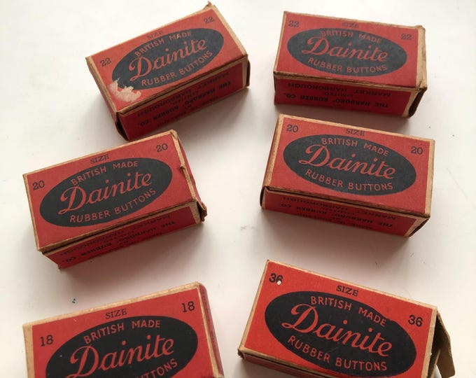 Vintage Dainite rubber buttons in boxes