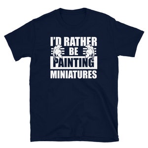 May include: A navy blue t-shirt with white text that reads "I'd rather be painting miniatures".