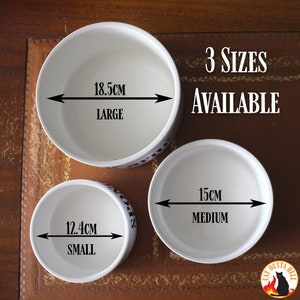 May include: Three white ceramic bowls in small, medium, and large sizes. The large bowl measures 18.5 cm, the medium bowl measures 15 cm, and the small bowl measures 12.4 cm in diameter. Text on the image reads 3 SIZES AVAILABLE and CAT OUTTA HELL.