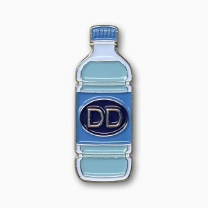 May include: A silver enamel pin shaped like a water bottle with a blue cap and a blue label that says "DD" in white letters.