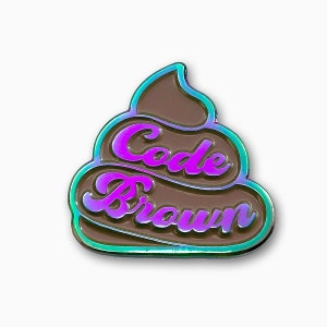 May include: A brown poop emoji pin with a rainbow iridescent finish. The text "Code Brown" is written in pink on the pin.