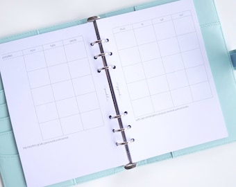 May include: A white weekly planner with a light blue cover. The planner has a section for priorities, a daily schedule, and a section for self-care reminders. The text "This month's goals (personal & professional)" is at the bottom of the page.