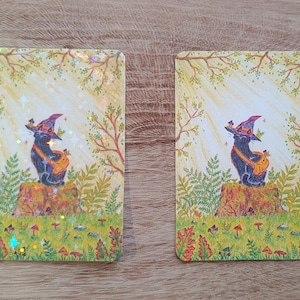 Pegatinas de vinilo holográfico y mate con estrellas de The Sunny Spot: una caprichosa pegatina de gato brujo
