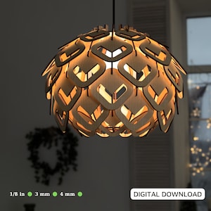 May include: A wooden pendant light fixture with a geometric design. The light is made of many small, overlapping pieces of wood that create a unique and modern look. The light is illuminated and casts a warm glow.
