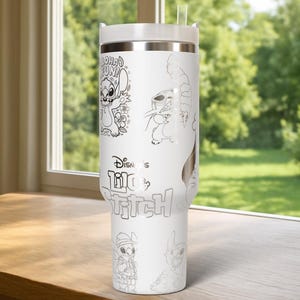 May include: White insulated tumbler featuring line art illustrations of Stitch from Disney's Lilo & Stitch. The tumbler includes the text "Aloha Fun!" and "Disney's Lilo & Stitch". It has a white lid and a clear straw.