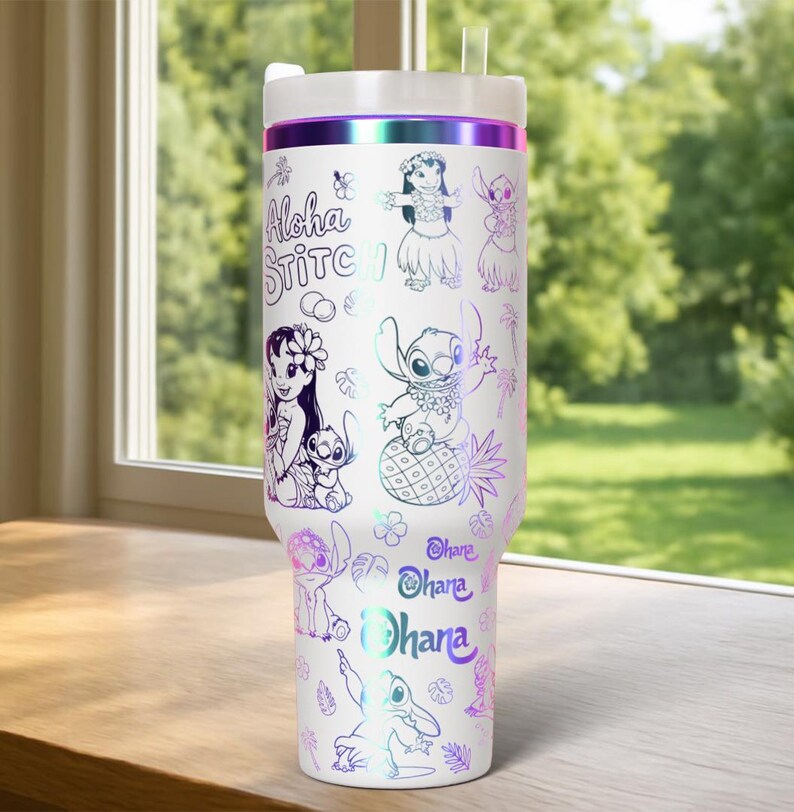 May include: White insulated travel mug with a lid and straw. The mug has a design featuring the words "Aloha Stitch" and cartoon characters in a holographic, iridescent finish. The design includes images of Stitch and Lilo.