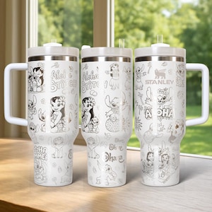 May include: Three white insulated tumblers with silver lids and handles. Each tumbler features a different design of the character Stitch from the Disney movie Lilo & Stitch, with the words "Aloha" and "Ohana" in a silver colour.