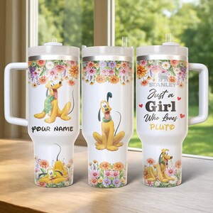 May include: Three white insulated tumblers with Pluto designs and floral accents. One tumbler reads "Your Name", another features Pluto, and the third says "Just a Girl Who Loves Pluto". Each tumbler has a white handle and lid.