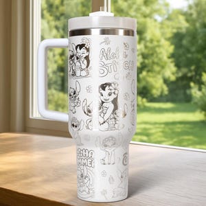 May include: White insulated travel mug with a handle, featuring black and white illustrations of Lilo & Stitch characters. The mug includes the text "Aloha Stitch" and "Summer". The lid and handle are white.