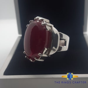 A statement silver ring of deep red cabochon Ruby. It is widely known as Anari Yaqoot Ring, Pomegranate Ruby gemstone Ring, Handmade 925 Silver Ring, Big Size Red Ruby ring. It is a perfect gift for men for birthday, anniversary and valentine day.