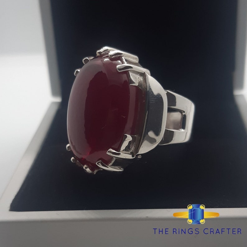 A statement silver ring of deep red cabochon Ruby. It is widely known as Anari Yaqoot Ring, Pomegranate Ruby gemstone Ring, Handmade 925 Silver Ring, Big Size Red Ruby ring. It is a perfect gift for men for birthday, anniversary and valentine day.