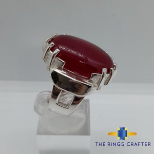 A statement silver ring of deep red cabochon Ruby. It is widely known as Anari Yaqoot Ring, Pomegranate Ruby gemstone Ring, Handmade 925 Silver Ring, Big Size Red Ruby ring. It is a perfect gift for men for birthday, anniversary and valentine day.
