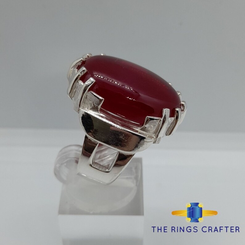 A statement silver ring of deep red cabochon Ruby. It is widely known as Anari Yaqoot Ring, Pomegranate Ruby gemstone Ring, Handmade 925 Silver Ring, Big Size Red Ruby ring. It is a perfect gift for men for birthday, anniversary and valentine day.