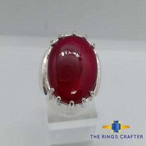 A statement silver ring of deep red cabochon Ruby. It is widely known as Anari Yaqoot Ring, Pomegranate Ruby gemstone Ring, Handmade 925 Silver Ring, Big Size Red Ruby ring. It is a perfect gift for men for birthday, anniversary and valentine day.