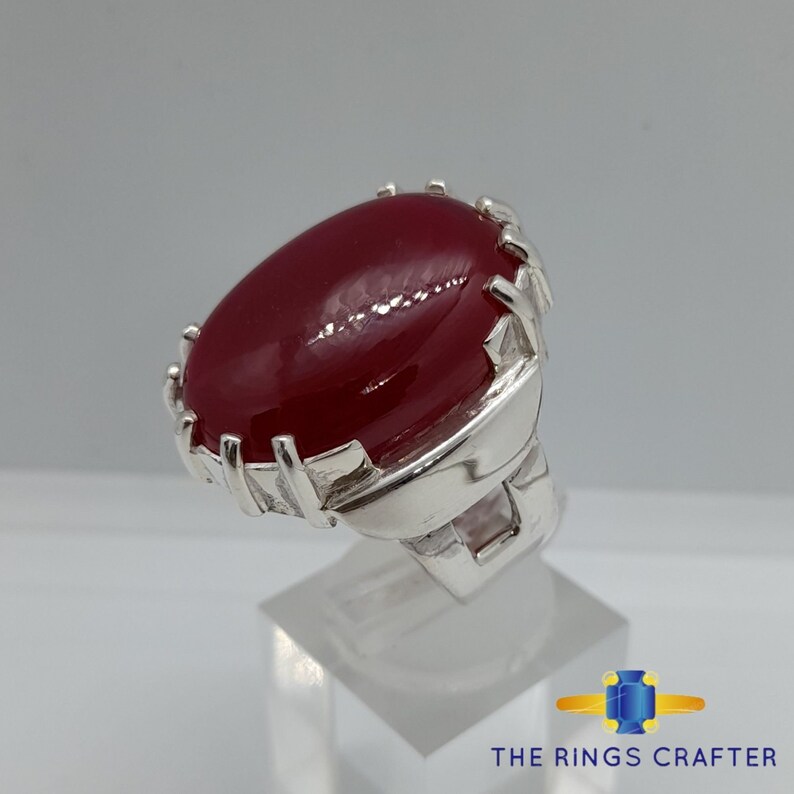 A statement silver ring of deep red cabochon Ruby. It is widely known as Anari Yaqoot Ring, Pomegranate Ruby gemstone Ring, Handmade 925 Silver Ring, Big Size Red Ruby ring. It is a perfect gift for men for birthday, anniversary and valentine day.