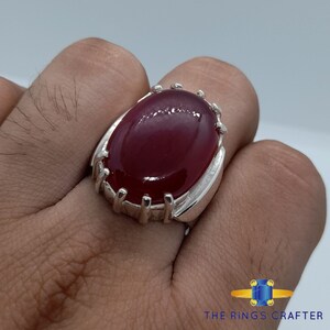 A statement silver ring of deep red cabochon Ruby. It is widely known as Anari Yaqoot Ring, Pomegranate Ruby gemstone Ring, Handmade 925 Silver Ring, Big Size Red Ruby ring. It is a perfect gift for men for birthday, anniversary and valentine day.