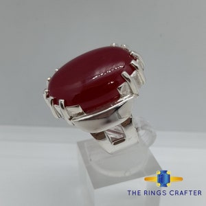 A statement silver ring of deep red cabochon Ruby. It is widely known as Anari Yaqoot Ring, Pomegranate Ruby gemstone Ring, Handmade 925 Silver Ring, Big Size Red Ruby ring. It is a perfect gift for men for birthday, anniversary and valentine day.