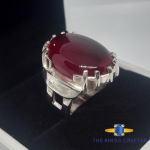 A statement silver ring of deep red cabochon Ruby. It is widely known as Anari Yaqoot Ring, Pomegranate Ruby gemstone Ring, Handmade 925 Silver Ring, Big Size Red Ruby ring. It is a perfect gift for men for birthday, anniversary and valentine day.