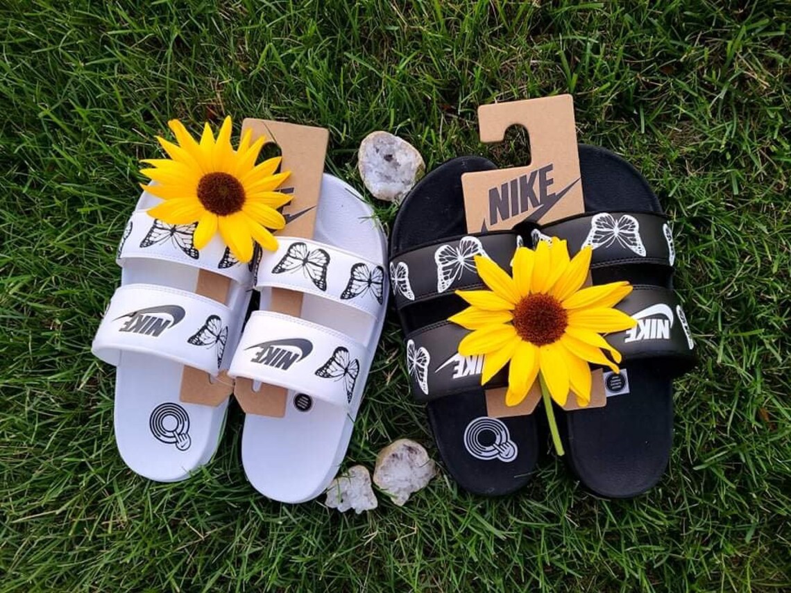 nike slides with butterflies