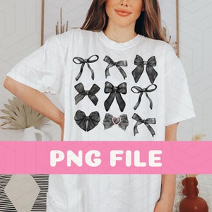 May include: White t-shirt featuring a grid of nine black bow illustrations. One bow has a pink heart-shaped center. The text "PNG FILE" is displayed in a pink banner across the bottom. The shirt is worn by a person.