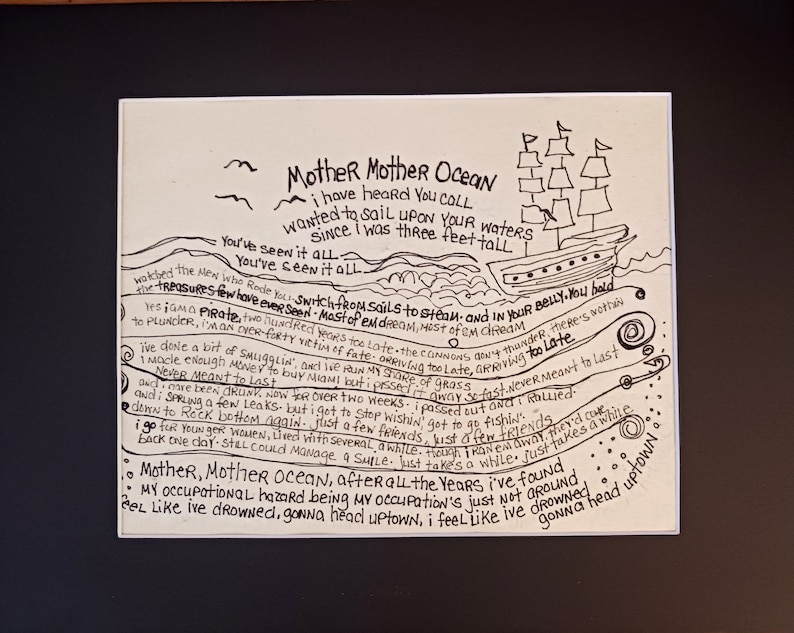 May include: A rectangular white print featuring black hand-lettered lyrics to the song Mother Mother Ocean. The design includes a sailing ship, stylized waves, and birds. The text details a narrative about a pirate, smuggling, and life at sea.