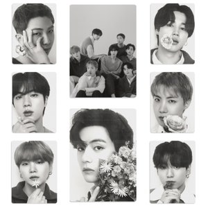 May include: Black and white photo collage of eight men. Each photo features a different man with a flower in their hand or near their face.