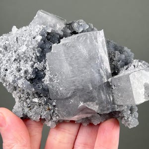 FLUORESCENT Gray Calcite on Druzy Quartz Matrix -- Nice Luster -- from Fujian, China