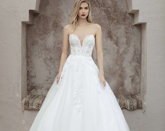 An Ultra-sparkly, show-stopping A-line wedding dress with a sweetheart neckline