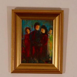 May include: A framed oil painting depicting a group of figures. The artwork features a gold frame and a vibrant color palette. The figures are dressed in various colors, including red, black, and green, against a blue background. The painting has an impressionistic style.