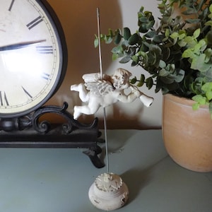 May include: A rustic wooden sign with the text "Welcome to our home" in white lettering. The sign features a distressed finish and a simple, inviting design, perfect for front door decor.