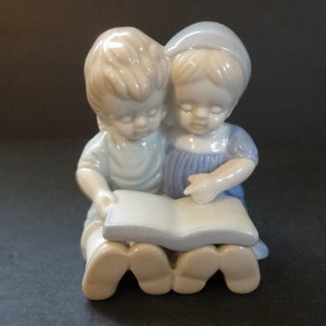 Sweet Vintage Porcelain Young Girl & Boy Reading a Book While Holding Each Other Close