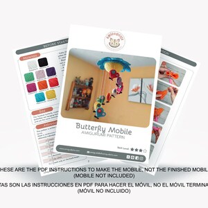 May include: PDF instructions for crocheting a butterfly mobile. The mobile features a blue cloud with a flower, butterflies, and a red heart. The instructions include a materials list, size guide, and abbreviations.