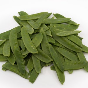Puede incluir: Un montón de guisantes verdes frescos, listos para cocinar.