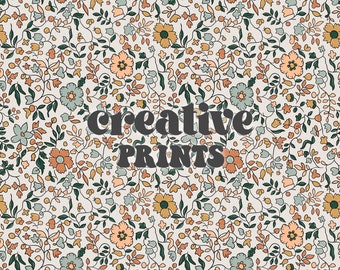 May include: A seamless pattern featuring a repeating design of small, delicate flowers in shades of peach, blue, and yellow on a cream background. The text "creative prints" is superimposed on the pattern.