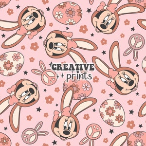 May include: A pink background with a repeating pattern of brown bunny ears, pink bows, peace signs, and Easter eggs with floral designs. The bunny ears have a cartoon face with brown eyes and a pink nose. The text "CREATIVE prints" is in the centre of the image.