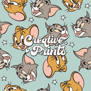 May include: A seamless pattern featuring cartoon characters Tom and Jerry. The background is a light blue color. The pattern includes stars and the text "Creative Prints".