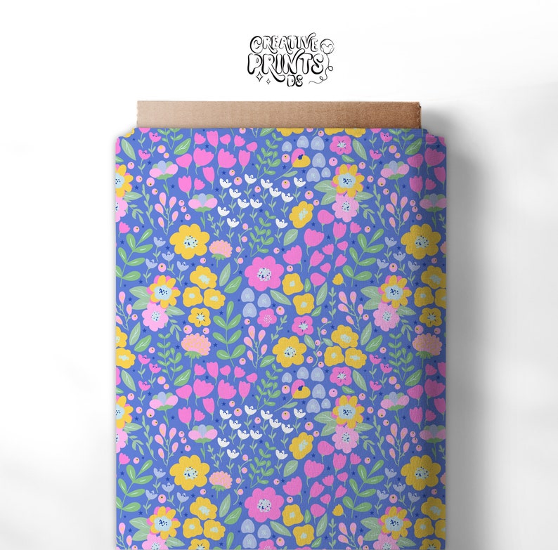 May include: A seamless pattern featuring a variety of colourful flowers on a light blue background. The flowers are pink, yellow, and white, and the pattern is perfect for fabric, wallpaper, or other creative projects.