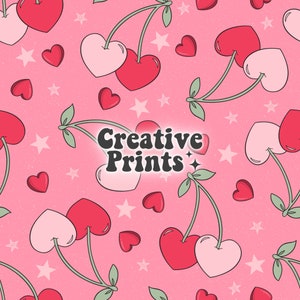 May include: A pink and red heart-shaped cherry pattern with white stars and hearts on a pink background. The text "Creative Prints" is in the centre of the image.