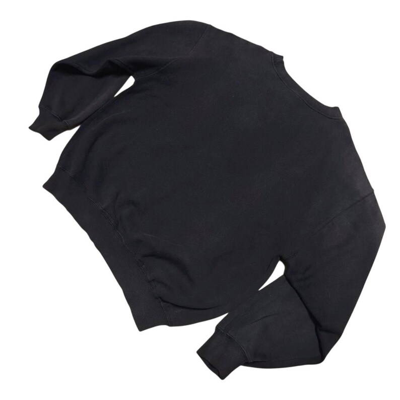 Vintage Nike crewneck sweatshirt featuring iconic spellout logo in classic black, Y2K sportswear style with relaxed unisex fit, perfect for streetwear, casual everyday wear, and vintage Nike collectors worldwide.