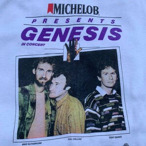 Vintage 80s Genesis Rock Band Tee Shirt 
80s Concert Michelob Tee Shirt
80s Michelob Beer Shirt
80s Band Tee Shirt
80s Vintage Rock Band Tee
80s Rock Tee Shirt Vintage
80s Graphic Tshirt
80s Retro Style Tee
80s Classic Tshirt
80s Music Shirt