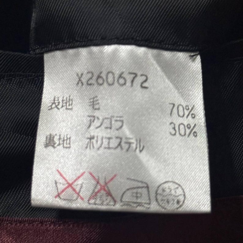 Vintage Mens black wool blend long overcoat featuring a minimalist button up design with stand collar made by A.A.R Durban Urban.Vintage coat ideal for fall and winter streetwear,office wear or layered casual looks.Classic and sleek,perfect for fashion forward individuals seeking timeless urban outerwear.This stylish trench style coat offers comfort,warmth and elegance for everyday city life or formal occasions.