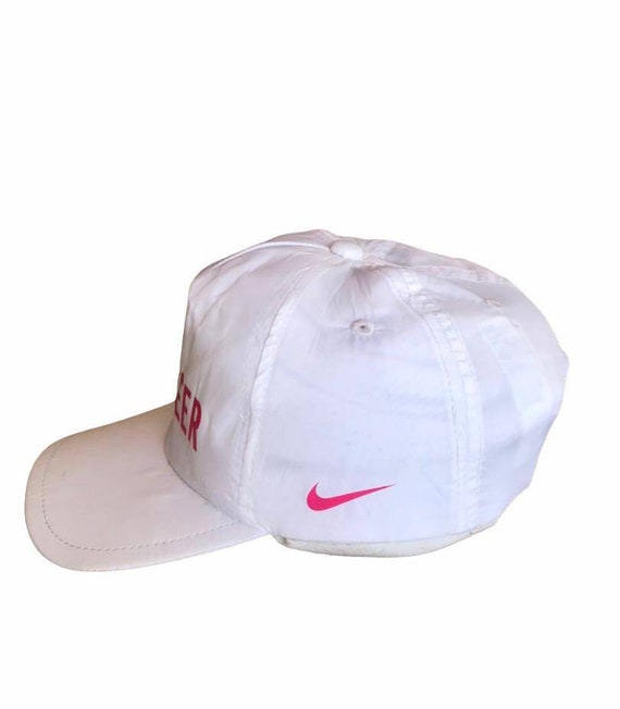 white nike hat with pink swoosh