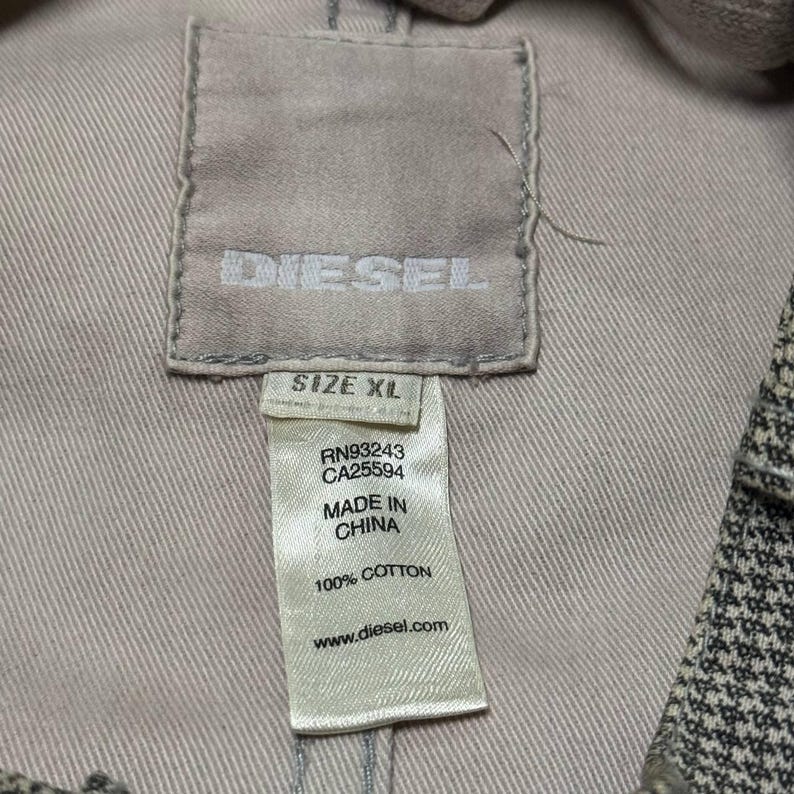 A vintage Diesel moto biker jacket with a checkered design featuring a full zip front, utility pockets and a streetwear aesthetic. Perfect for casual layering unisex fashion.