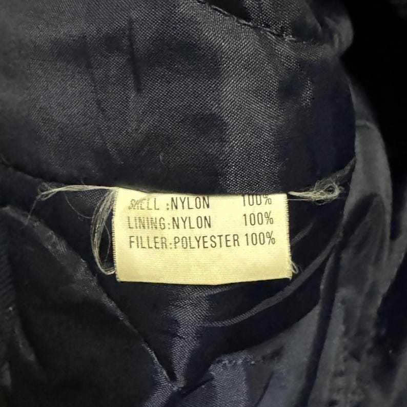 Vintage Avirex MA 1 Bomber Jacket Navy USA Flight Jacket 90s Streetwear Military Jacket Classic Zip Up Nylon Bomber Coat For Men And Women Rare Avirex USA Outerwear Piece With Iconic Back Logo Design.