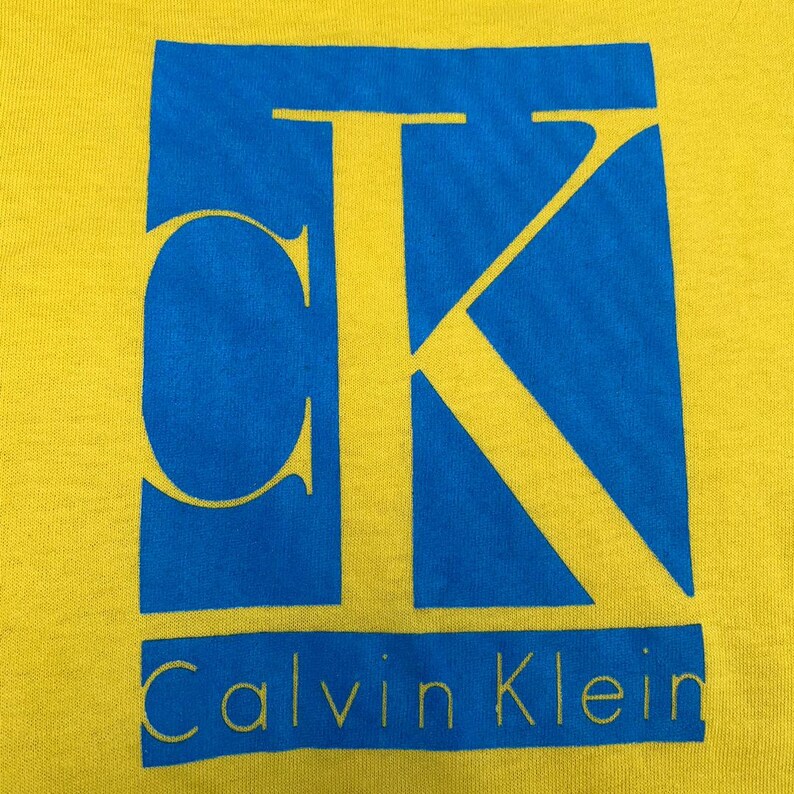 Vintage Calvin Klein Graphic Tshirt Medium Size Yellow Color Big Logo