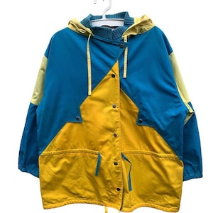 May include: A blue and yellow hooded jacket with a button closure and a drawstring at the bottom.